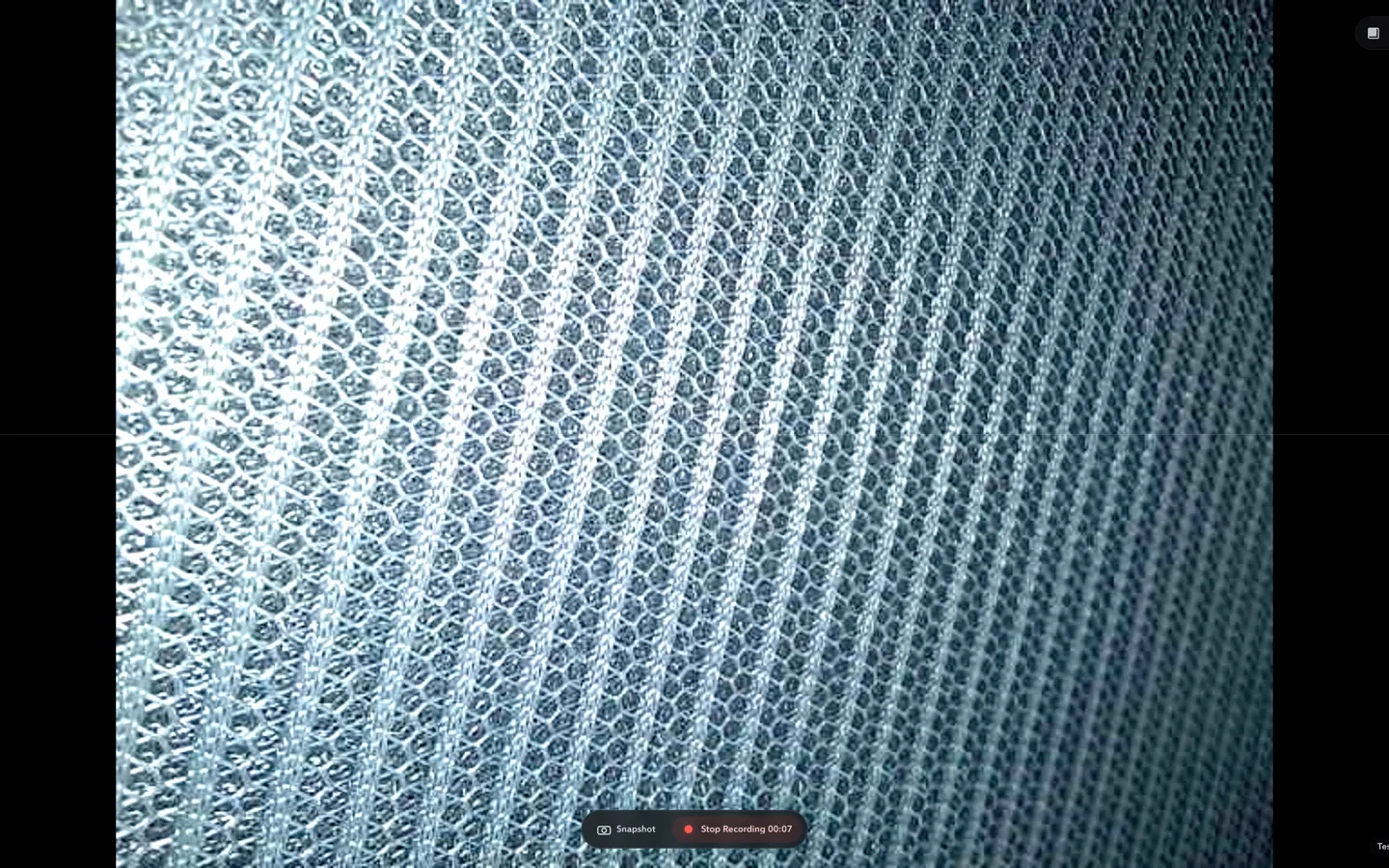 Fabric texture in a ScopeDock close-up preview with snapshot and recording controls.